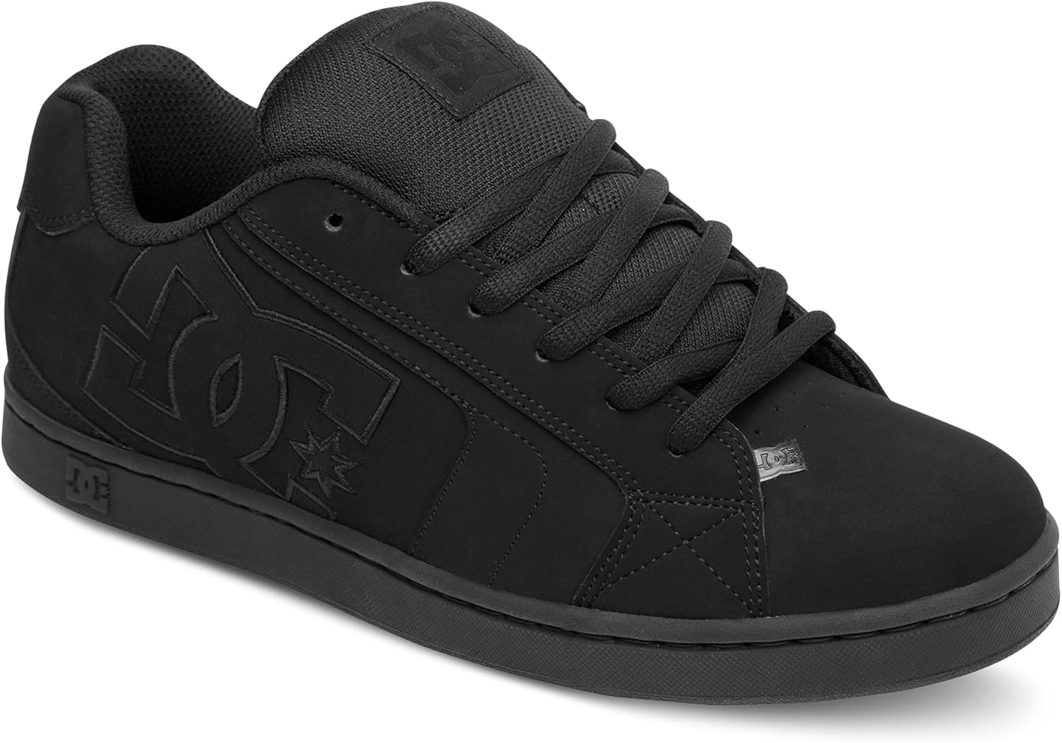 DC black skate shoes on a skate park ramp